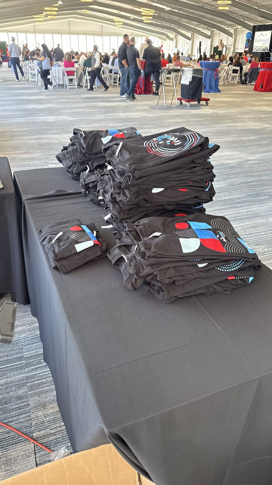 Merch Troop live printing — fresh prints off the platen